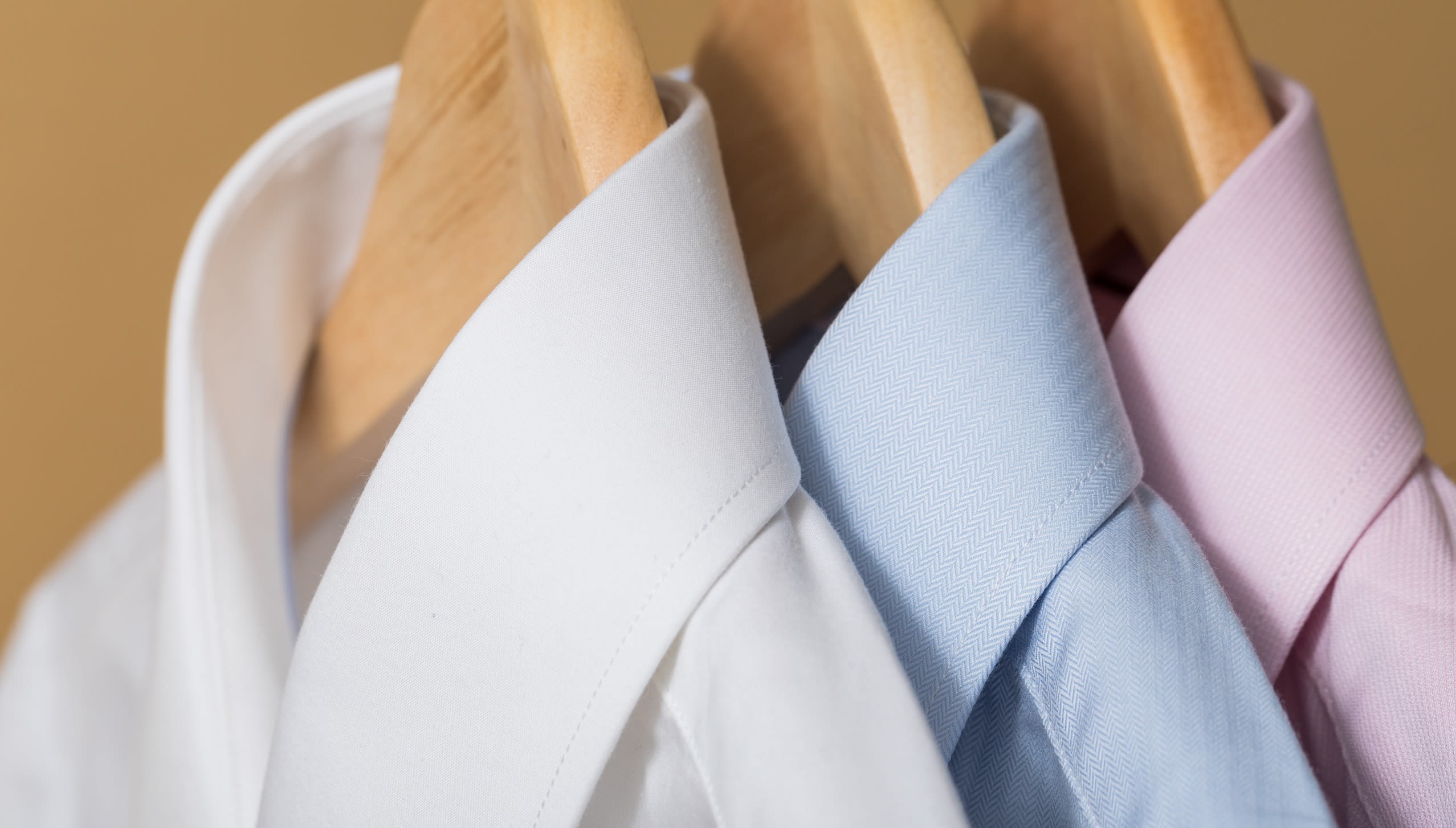 White, blue and pink collared shirts