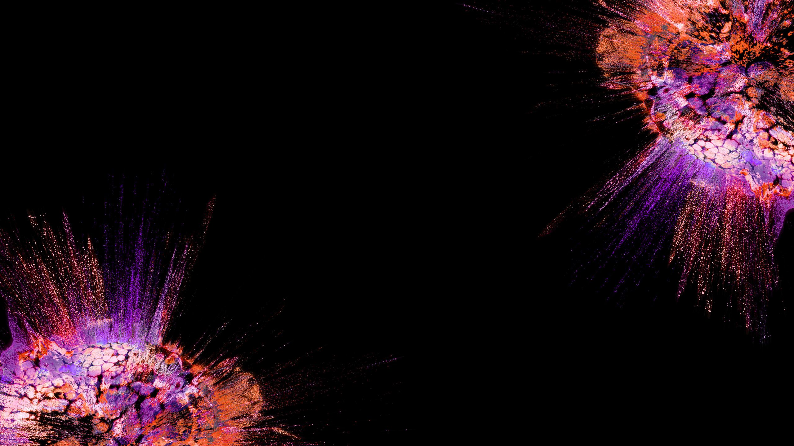 Orange and purple splashes on a black backdrop