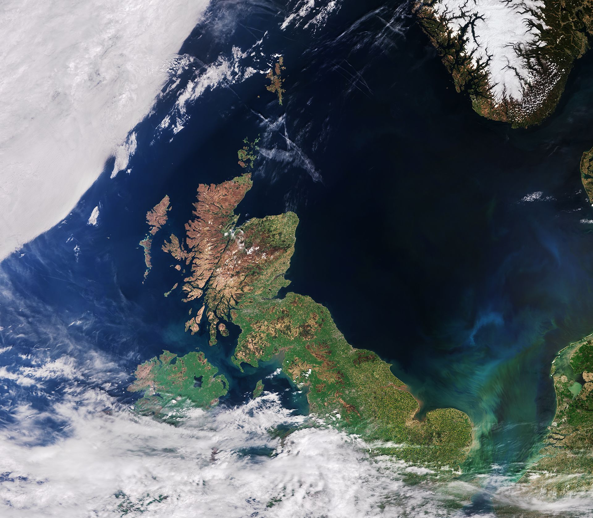 Satellite image of the UK captured from above. Northern England and Scotland are not covered by cloud, whilst the south west and Ireland are
