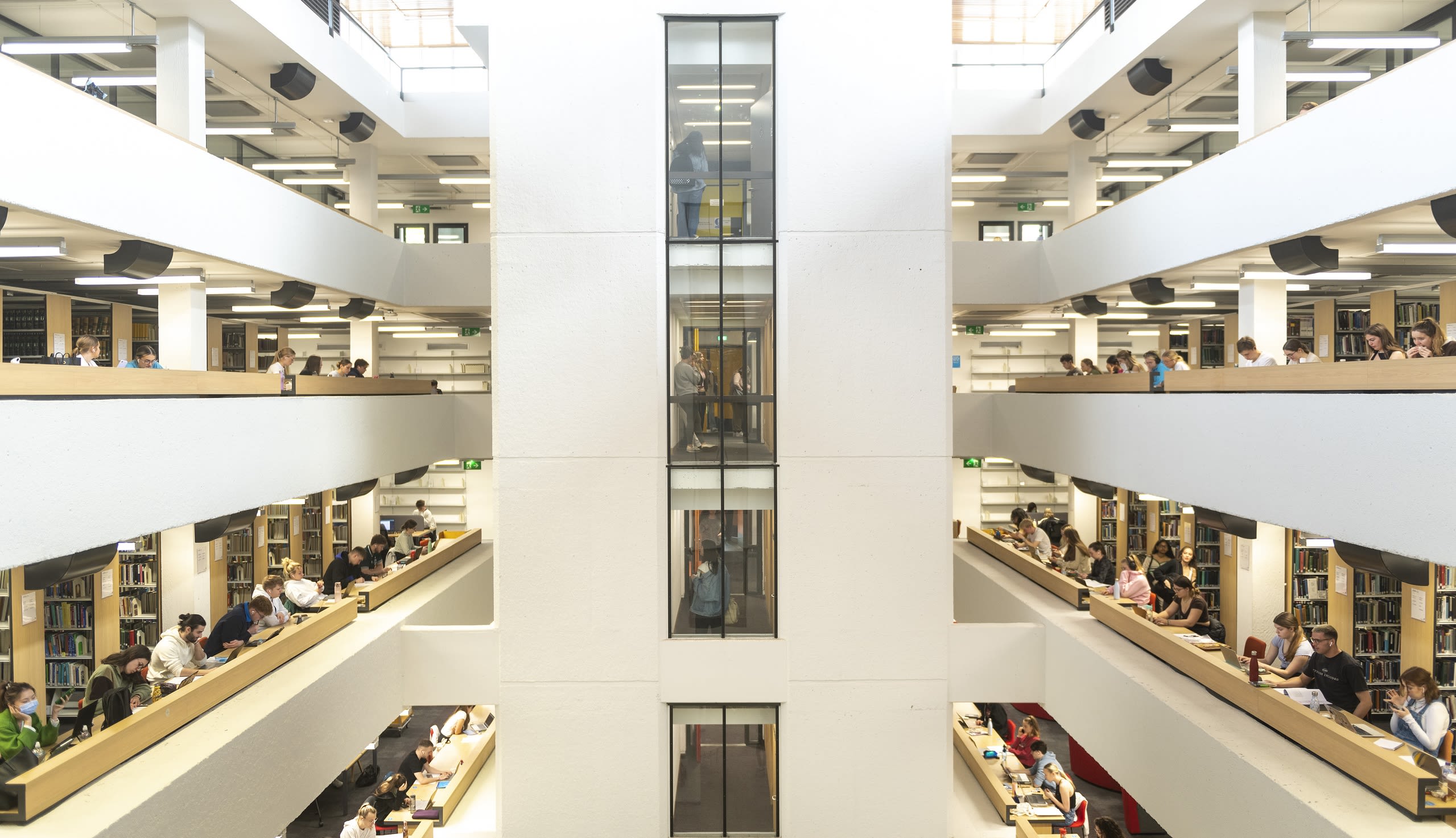 The atrium of the Edward Boyle Library, with students working across three floors